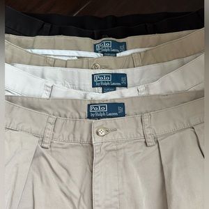 Lot of 4 men’s khaki and black shorts with pleats size 34